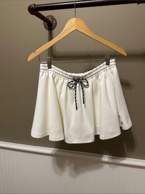 The Upside Cream Circle skort with Navy Drawstring